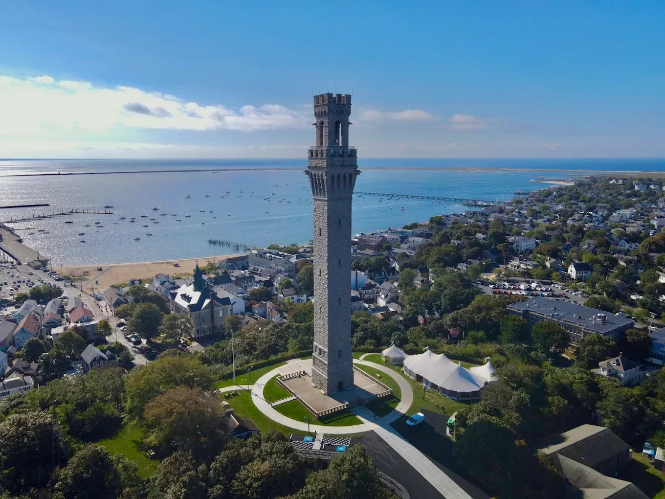 Pilgrim Monument and Provincetown Museum in Cape Cod with a dog beach in the background