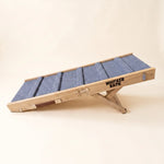 Side view of the Whisker Bark folding dog ramp unfolded with the support leg locked in position.