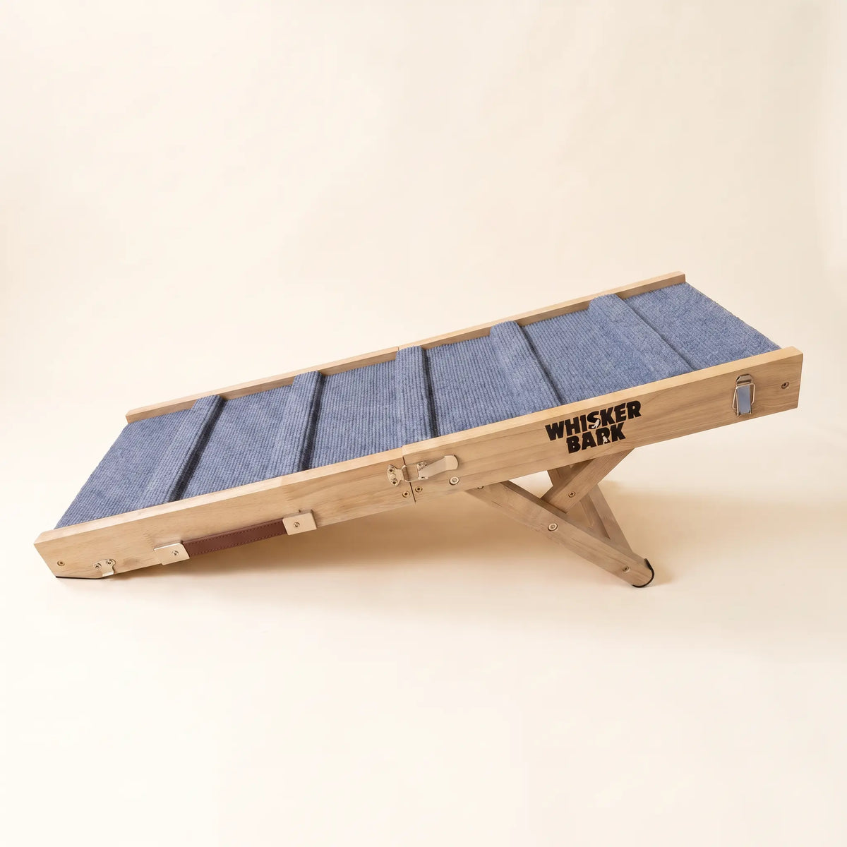 Side view of the Whisker Bark folding dog ramp unfolded with the support leg locked in position.